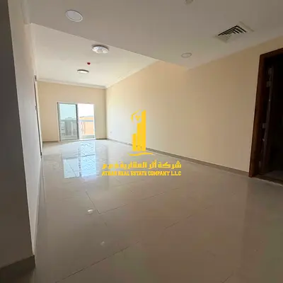 First occupancy, largest one-bedroom apartment for annual rent in Al Jurf 3 with private parking, brand new building.