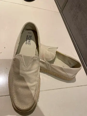 Beige TOMS canvas slip-on shoes, size 45/46. Worn one time only