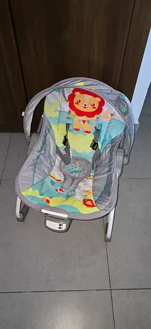 Baby bouncer / rocker with toy bar - good condition