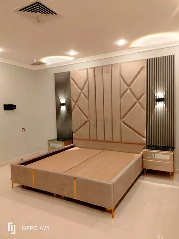 Modern upholstered king bed frame with padded headboard and matching nightstands
