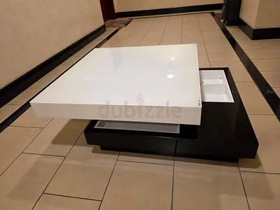 Modern Square Coffee Table with Rotating Top and Storage