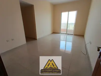 Two bedrooms and a large living room with a balcony in Al Rawda 1 area, behind Al Hamida Police Station, near all services.