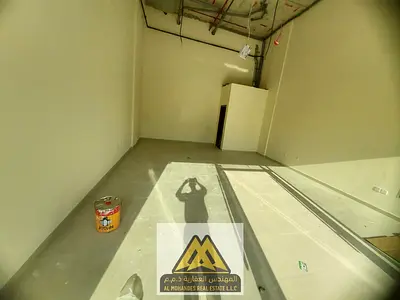 Commercial shop for annual rent in Ajman Industrial Area 1, located on Omar Bin Al Khattab Street. Prime location with active commercial movement, sui
