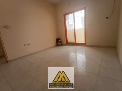 Annual rental: 1-bedroom apartment with a living room in Al Nuaimiya 1, Ajman. Balcony, spacious area, near Al Hikma School, easy access to Dubai and