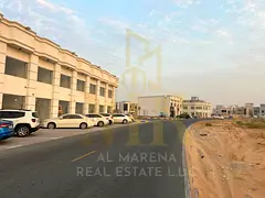 Prime residential/commercial land for sale in Al Zahia, Ajman, with G+2 permit, directly on Sheikh M