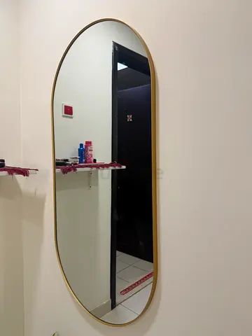 Gold oval wall mirror - modern, slim frame (large)