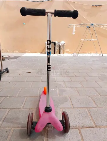 Pink three-wheel kids scooter — good condition