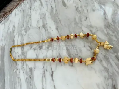 Hand-carved bone elephant necklace with wooden beads