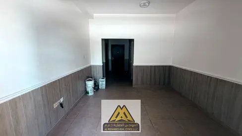 1BR hall in Al Rawda 2, balcony view, laundry room, wardrobes, AED 30k yearly, 4 payments.