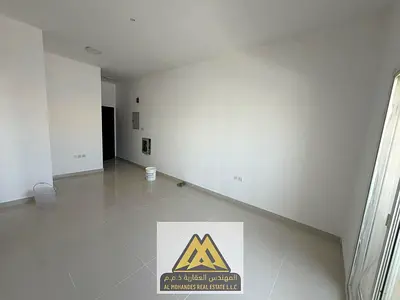 Annual Rent – Two-bedroom apartment with a living room in Al Jurf 3, featuring a master bedroom, 2 bathrooms, a balcony, free maintenance, and a clean