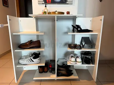 FIRE MOVE OUT SALE! White two-door storage cabinet / shoe rack in very good condition!