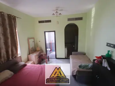 For rent: studio in Al Alia, Ajman. Quiet area, good finishing, close to services. AED 18,000 yearly in 4 payments. Suitable for individuals and famil