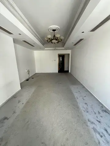 Two bedrooms, a living room, and a maid's room with a bathroom.