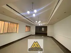 Two-story villa for annual rent in Al Mowaihat 3, Ajman. Features 4 bedrooms, 2 halls, majlis, maid