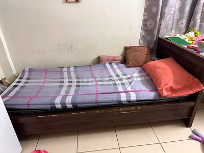 Single wooden bed with headboard — good used condition