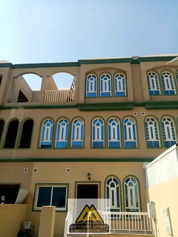 اب تاون فيلا بمنطقة الزاهية عجمان على شارع محمد بن زايد الرئيسي بجوار مركز القبائل وجميع الخدمات