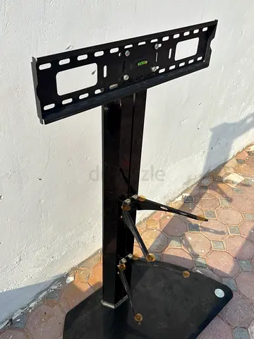 Free-standing TV stand with glass base and adjustable mount