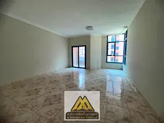 A spacious apartment featuring two bedrooms, a large living room, a maid's room, three bathrooms, an