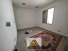 Studio for annual rent in Al Rawda 1, Ajman, ground floor, spacious layout, central AC, semi-separat