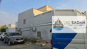 For sale: Corner house in Umm Khanoor. It has three sections: Section 1 has 3 bedrooms, a living roo
