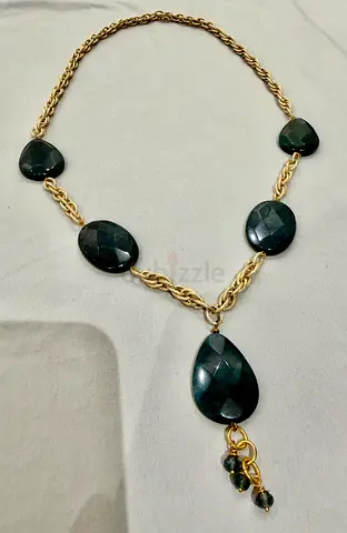 Gold-tone chain necklace with dark green faceted stone pendants