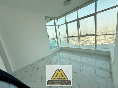 Two-bedroom apartment with a spacious living room and pool view for annual rent in Al Waha Towers, Ajman