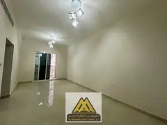 Annual rent: 1-bedroom apartment in Al Yasmeen, new building, 2 bathrooms, balcony, central AC, AED