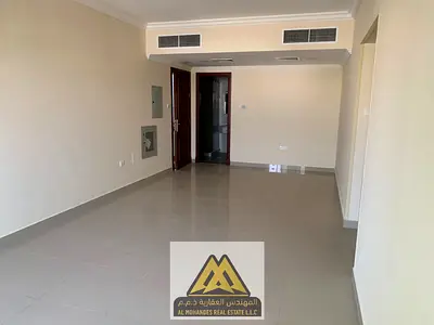 Annual rental: Apartment in Al Jurf 2 – Ajman, featuring 2 bedrooms, a living room, 2 bathrooms, built-in wardrobes, a balcony, and central air condit