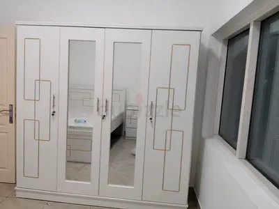 Customised 4-Door Wardrobe with Mirrors and Gold Trim -