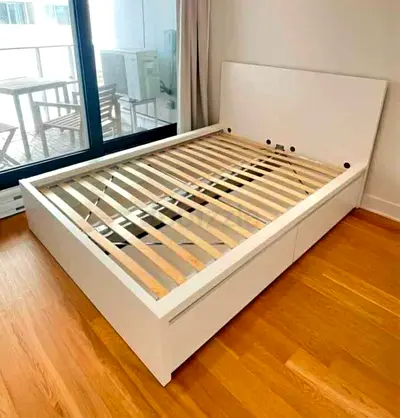 White wooden double bed frame with storage drawers - good condition