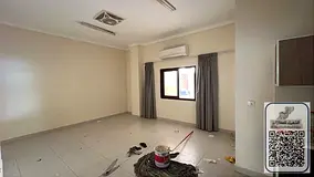 A distinctive studio apartment in Rawda 2, Ajman, featuring a spacious semi-detached kitchen and a p