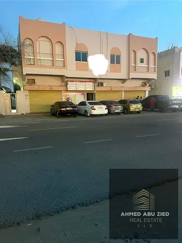G+1 Residential Commercial Building for Sale in Al Rawdha 3 Ajman near Sheikh Ammar Street, 7200 sqft plot with apartments and shops, generating 10% a