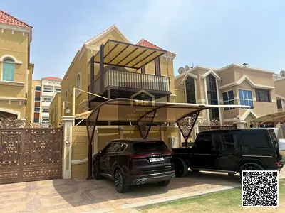 A two-story villa with a terrace, freehold, in one of the most upscale areas of Ajman, on a main street, price includes electricity, water, and air co