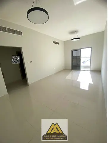 Annual rent: 2-bedroom apartment in Al Jurf 3, spacious layout, balcony, central AC, free maintenance, AED 45,000 in 6 payments.