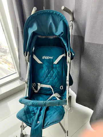 Lightweight teal umbrella stroller in good condition