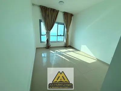 Annual apartment for rent in Corniche Tower, Ajman. Two bedrooms, living room, full sea view, 2 balconies, all bedrooms are master with built-in wardr