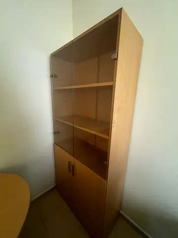 Light wood storage cabinet with glass doors and lower cupboard — good condition