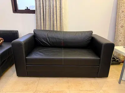 2-Seater Sofa cum bed made of faux leather in excellent condition