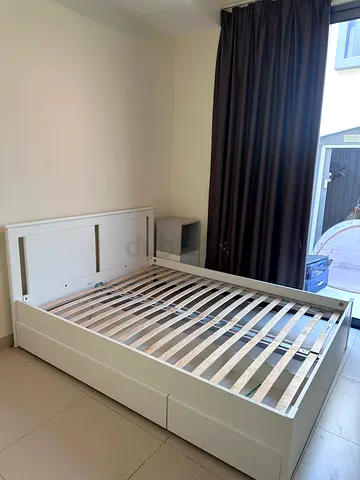 White wooden double bed frame with storage drawers - good condition