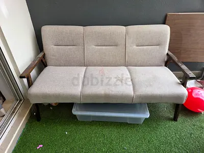 3-seater fabric sofa with wooden arms — good for balcony or living room