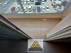 Two-bedroom apartment with a living room and balcony in Al Nuaimiya 1, strategically located near Al
