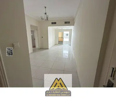 For rent: 2-bedroom apartment with hall in Al Nuaimiya 1, Ajman, spacious area, balcony, 2 bathrooms, prime location near services.