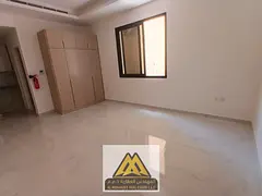Studio for annual rent in Al Alia, Ajman, first tenant, large area, separate kitchen, excellent fini
