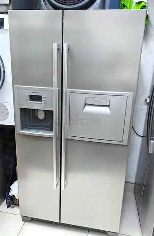 Siemens side-by-side stainless steel refrigerator with ice/water dispenser