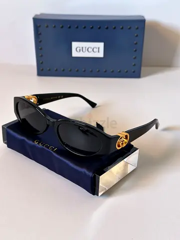 Gucci Black Oval Sunglasses with Gold Interlocking G