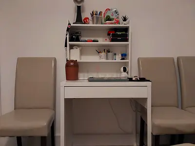 Compact white study desk with shelving and storage
