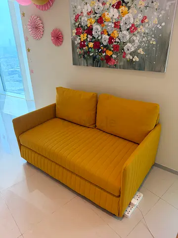 Compact mustard IKEA yellow 2-seater sofa cum bed in good condition
