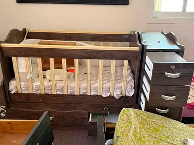 Wooden baby crib with attached dresser - good condition