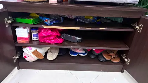 Dark wood shoe cabinet with three shelves - good condition