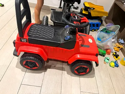 Red ride-on electric toy car for toddlers - good working condition